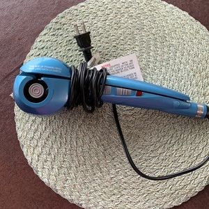 Nano Titanium by BABYLISS PRO CURLING MACHINE.